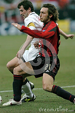 Andrea Pirlo and Roy Keane in action during the match Editorial Stock Photo